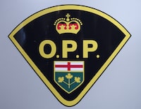 An Ontario Provincial Police logo is shown in Barrie, Ont., on Wednesday, April 3, 2019. Police say a 25-year-old man is dead after he drowned in Lake Ontario over the weekend.THE CANADIAN PRESS/Nathan Denette