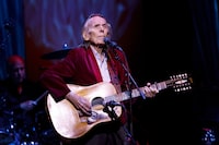 Gordon Lightfoot performs during the first concert at the newly re-opened Massey Hall in Toronto, Thursday, Nov. 25, 2021. Canadian folk icon Lightfoot is cancelling his 2023 concert schedule in Canada and the U.S. THE CANADIAN PRESS/Cole Burston