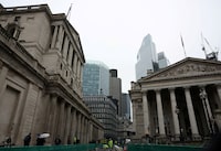 Road construction workers carry out work outside the Bank of England in the City of London financial district in London, Britain, February 13, 2024.