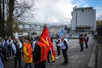 Public Service Alliance of Canada members who are employees at the Canadian Grain Commission picket outside the Viterra Cascadia Terminal, in Vancouver, on Monday, April 24, 2023. The grain terminal handles wheat, durum, canola, barley, rye, oats and by-products that arrive by rail and are loaded on bulk carrier ships for export. THE CANADIAN PRESS/Darryl Dyck