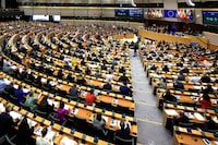 Members of European Parliament participate in a series of votes as they attend a plenary session at the European Parliament in Brussels, Wednesday, April 10, 2024. Lawmakers are voting Wednesday on a major revamp of the European Union's migration laws aiming to end years of division over how to manage the entry of thousands of people without authorization and deprive the far-right of a vote-winning campaign issue ahead of June elections. (AP Photo/Geert Vanden Wijngaert)