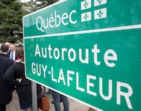 Quebec Premier Francois Legault speaks with local residents as he leaves a ceremony, Thursday, May 4, 2023 in Thurso, Que. Legault announced a provincial highway would be named after the hockey legend Guy Lafleur. THE CANADIAN PRESS/Adrian Wyld
