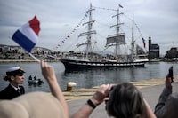 French 19th-century three-masted barque Belem sets sails from the Piraeus port, near Athens, with the Olympic flame on board to begin its journey to France on April 27, 2024, a day after Greece handed over the torch of the 2024 Games to Paris organisers. The Belem is set to reach Marseille on May 8 and ten thousand torchbearers will then carry the flame across 64 French territories. It will travel through more than 450 towns and cities, and dozens of tourist attractions during its 12,000-kilometre (7,500-mile) journey through mainland France and overseas French territories in the Caribbean, Indian Ocean and Pacific. On July 26 it will form the centrepiece of the Paris Olympics opening ceremony. (Photo by ANGELOS TZORTZINIS / AFP) (Photo by ANGELOS TZORTZINIS/AFP via Getty Images)