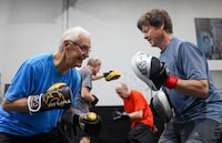 Larry Malazdrewicz, 73, left and Bill Darling, 65, both living with Parkinson's disease, box during the Grizzly Strides boxing program at Grizzly Boxing and Fitness in Calgary, Alberta, Canada May 17, 2023. The program is for those living with Parkinson's disease. LEAH HENNEL / THE GLOBE AND MAIL