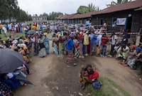 Voters wait for a polling station to open for voters in the village of Bulenga in South Kivu, DR Congo, on December  20, 2023. Polling stations were not open due to technical problems. 
GORAN TOMASEVIC/THE GLOBE AND MAIL