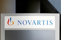 FILE PHOTO: The logo of Swiss drugmaker Novartis is pictured at the French company's headquarters in Rueil-Malmaison near Paris, France, April 22, 2020. REUTERS/Charles Platiau/File Photo