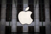 FILE PHOTO: An Apple logo hangs above the entrance to the Apple store on 5th Avenue in the Manhattan borough of New York City, July 21, 2015. REUTERS/Mike Segar/File Photo