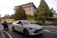 A BYD's electric vehicle (EV) Qin moves on a street in Beijing, China October 31, 2023. REUTERS/Tingshu Wang/ File Photo
