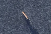 In this satellite image provided by Planet Labs, the Belize-flagged bulk carrier Rubymar is seen in the southern Red Sea near the Bay el-Mandeb Strait leaking oil after an attack by Yemen's Houthi rebels Tuesday, Feb. 20, 2024. Despite a month of U.S.-led airstrikes, Yemen's Iran-backed Houthi rebels remain capable of launching significant attacks. This week, they seriously damaged a ship in a crucial strait and apparently downed an American drone worth tens of millions of dollars. (Planet Labs PBC via AP)