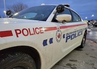 A 40-year-old man from Mississauga is facing criminal charges after the neck of a 34-year-old woman was slashed during a domestic dispute in Whitby, Ont. A Durham Regional Police car is shown at a Bowmanville, Ont. shopping centre parking lot on Tuesday Feb. 28, 2023. THE CANADIAN PRESS/Doug Ives
