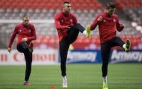 Canadian men's national soccer team players Samuel Piette, from left, Marcus Haber and Adam Straith stretch during practice in Vancouver, B.C., on Thursday November 12, 2015. Pacific FC, Victoria's entry in the new Canadian Premier League, has signed Canadian international striker Marcus Haber. THE CANADIAN PRESS/Darryl Dyck