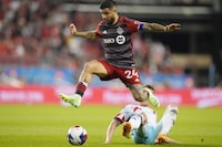Toronto FC's Lorenzo Insigne skips over a challenge from Chicago Fire's Fabian Herbers during second half MLS action in Toronto on Wednesday, May 31, 2023. Insigne saw 62 minutes action in Toronto FC's season debut Sunday, a scoreless draw at FC Cincinnati. Less is more could be a TFC trend this season when it comes to the former Napoli captain as coach John Herdman and his staff look to keep the 32-year-old healthy for the season.THE CANADIAN PRESS/Chris Young