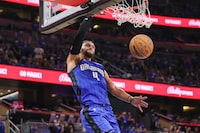 Apr 25, 2024; Orlando, Florida, USA; Orlando Magic guard Jalen Suggs (4) dunks during the second half against the Cleveland Cavaliers during game three of the first round for the 2024 NBA playoffs at Kia Center. Mandatory Credit: Mike Watters-USA TODAY Sports