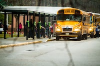 FILE - Students exit a school bus during the first day back to Richneck Elementary School on Jan. 30, 2023, in Newport News, Va. A grand jury in Virginia has indicted the mother of a 6-year-old boy who shot his teacher on charges of child neglect and failing to secure her handgun in the family's home, a prosecutor said Monday, April 10, 2023. (AP Photo/John C. Clark, File)