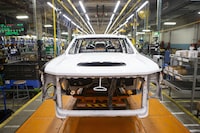 The frame of a Chevrolet Silverado sits on the assembly line at the GM plant in Oshawa, Ont., on Tuesday, Feb. 22 2022.