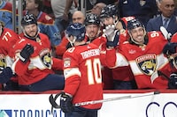 Florida Panthers right wing Vladimir Tarasenko (10) is congratulated after scoring during the second period of an NHL hockey game against the Calgary Flames, Saturday, March 9, 2024, in Sunrise, Fla. (AP Photo/Lynne Sladky)