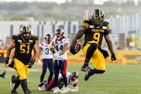Hamilton Tiger-Cats running back James Butler (9) celebrates a touchdown during CFL football game action against the Montreal Alouettes in Hamilton, Ont. on Saturday, August 5, 2023. THE CANADIAN PRESS/Nick Iwanyshyn