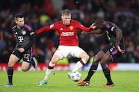 MANCHESTER, ENGLAND - DECEMBER 12: Rasmus Hojlund of Manchester United battles for possession with Dayot Upamecano of Bayern Munich during the UEFA Champions League match between Manchester United and FC Bayern München at Old Trafford on December 12, 2023 in Manchester, England. (Photo by Michael Steele/Getty Images)