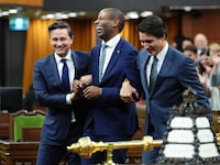 Newly elected Speaker of the House of Commons Greg Fergus is escorted into the House of Commons by Prime Minister Justin Trudeau and Conservative Leader Pierre Poilievre on Parliament Hill in Ottawa on Tuesday, Oct. 3, 2023. Liberal member of Parliament Fergus has been
elected the House of Commons Speaker in a historic mid-session vote. THE CANADIAN PRESS/Sean Kilpatrick