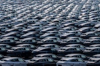 New electric cars for sale are seen parked at a distribution center of the Changan automobile company in southwestern China's Chongqing municipality on March 24, 2024. (Photo by AFP) / China OUT (Photo by STR/AFP via Getty Images)