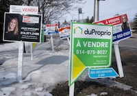 Condo for sale signs are seen in Deux-Montagnes, Que., Wednesday, March 29, 2023. THE CANADIAN PRESS/Ryan Remiorz