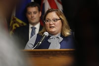 Alberta's former deputy premier entered the province's NDP leadership Sunday with criticism of both the federal carbon levy and Prime Minister Justin Trudeau. Sarah Hoffman responds to a reporter's questions at a press conference in Winnipeg on June 28, 2018. THE CANADIAN PRESS/John Woods
