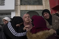Five members of Parliament are in the Middle East to hear from Palestinians living outside of the Gaza Strip about how Canada can best help them. Palestinian women cry after taking the last look at the body of Suleiman Kanan, 17, during his funeral in the West Bank town of Bir Zeit, Monday, Jan. 15, 2024. THE CANADIAN PRESS/AP/Nasser Nasser