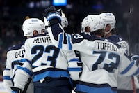 COLUMBUS, OHIO - MARCH 17:  Tyler Toffoli #73 of the Winnipeg Jets is congratulated by his teammates after scoring a goal during the third period of the game against the Columbus Blue Jackets at Nationwide Arena on March 17, 2024 in Columbus, Ohio. Winnipeg defeated Columbus 6-1. (Photo by Kirk Irwin/Getty Images)