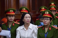 Business woman Truong My Lan, front center, attends a trial in Ho Chi Minh City, Vietnam on Thursday, April 11, 2024. The real estate tycoon may face the death penalty if convicted of allegations that she siphoned off an amount of $12.5 billion, nearly 3 percent of Vietnam's 2022 GDP, in its largest financial fraud case. (Thanh Tung/VnExpress via AP)