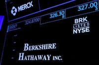 Trading information and logo for Berkshire Hathaway is displayed on a screen on the floor of the New York Stock Exchange (NYSE) in New York City, U.S., May 10, 2023.  REUTERS/Brendan McDermid