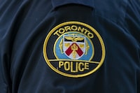 The Toronto police hate-crime unit has charged a woman who allegedly vandalized a Starbucks in a Jewish neighbourhood. A&nbsp;Toronto Police Service logo patch is shown in Toronto, on Tuesday, Sept. 5, 2023. THE CANADIAN PRESS/Spencer Colby