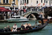 People protest against the introduction of the registration and tourist fee to visit the city of Venice for day trippers introduced by Venice municipality in a move to preserve the lagoon city often crammed with tourists in Venice, Italy, April 25, 2024. REUTERS/Manuel Silvestri     TPX IMAGES OF THE DAY