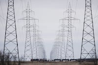 Severe drought in Western Canada is putting pressure on hydroelectricity generation, forcing two hydro-rich provinces to import power from other jurisdictions due to low reservoir levels. Manitoba Hydro power lines are photographed just outside Winnipeg, Monday, May 1, 2018. THE CANADIAN PRESS/John Woods