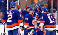 ELMONT, NEW YORK - DECEMBER 11: The New York Islanders celebrate their 4-3 overtime win over the Toronto Maple Leafs at UBS Arena on December 11, 2023 in Elmont, New York. (Photo by Bruce Bennett/Getty Images)