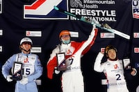 PARK CITY, UTAH - FEBRUARY 02: Connor Curran of Team United States (L), Alexandre Duchaine of Team Canada (C), and Guangpu Qi of Team China (R) pose on the podium after the super final of the Men's Aerials Competition at the Intermountain Healthcare Freestyle International Ski World Cup at Deer Valley on February 02, 2024 in Park City, Utah. (Photo by Sarah Stier/Getty Images)