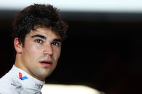 LUSAIL CITY, QATAR - OCTOBER 06: 17th placed qualifier Lance Stroll of Canada and Aston Martin F1 Team looks on in the FIA garage during qualifying ahead of the F1 Grand Prix of Qatar at Lusail International Circuit on October 06, 2023 in Lusail City, Qatar. (Photo by Mark Thompson/Getty Images)