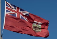 Unionized workers at Manitoba's automobile insurance Crown corporation are set to strike on Monday morning. The flag of Manitoba flies on Monday, November 1, 2021 in Ottawa. THE CANADIAN PRESS/Adrian Wyld