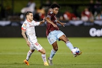 Jul 31, 2023; Commerce City, CO, USA; Colorado Rapids midfielder Ralph Priso (97) controls the ball ahead of Toluca midfielder Jesus Angulo (10) in the second half at Dick's Sporting Goods Park. Mandatory Credit: Isaiah J. Downing-USA TODAY Sports
