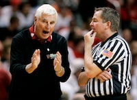 FILE - Texas Tech coach Bob Knight, left, argues a call with an NCAA official during a basketball game against Texas A&M in Lubbock, Texas, Wednesday, Jan. 16, 2008. Knight earned his 900th career win in the 68-53 win over Texas A&M. Bob Knight, the brilliant and combustible coach who won three NCAA titles at Indiana and for years was the scowling face of college basketball has died. He was 83. Knight's family made the announcement on social media Wednesday evening, Nov. 1, 2023. (AP Photo/Tony Gutierrez, File)