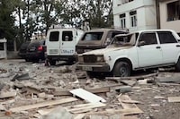 A video grab made on September 20, 2023 from footage released by the Nagorno-Karabakh Foreign Ministry shows wreckages littering a street around damaged cars in Stepanakert, on the first day of Azerbaijan's renewed offensive on the region. Karabakh authorities claimed 25 people, including two civilians, were killed in the fighting, while Azerbaijan warned it would "continue until the end" in the territory. (Photo by Nagorno-Karabakh Foreign Ministry / AFP) / RESTRICTED TO EDITORIAL USE - MANDATORY CREDIT "AFP PHOTO /NAGORNO-KARABAKH FOREIGN MINISTRY " - NO MARKETING NO ADVERTISING CAMPAIGNS - DISTRIBUTED AS A SERVICE TO CLIENTS (Photo by -/Nagorno-Karabakh Foreign Ministr/AFP via Getty Images)
