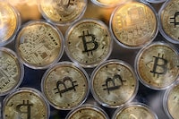 Physical imitations of bitcoins are pictured at a cryptocurrency exchange branch near the Grand Bazaar in Istanbul on October 20, 2021.