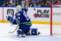 Mar 21, 2024; Vancouver, British Columbia, CAN;Vancouver Canucks goalie Casey DeSmith (29) watches the puck bounce off the post against the Montreal Canadiens  in the second period at Rogers Arena. Mandatory Credit: Bob Frid-USA TODAY Sports