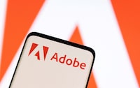 FILE PHOTO: FILE PHOTO: Adobe logo is seen on smartphone in this illustration taken June 13, 2022. REUTERS/Dado Ruvic/Illustration/File Photo/File Photo