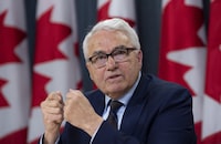 Official Languages Commissioner Raymond Theberge responds to a question during a news conference in Ottawa, Thursda, May 9, 2019. THE CANADIAN PRESS/Adrian Wyld