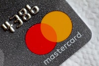 FILE PHOTO: FILE PHOTO: A Mastercard logo is seen on a credit card in this picture illustration August 30, 2017.   REUTERS/Thomas White//File Photo/File Photo