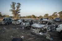Destroyed cars at the site of the music festival that was overrun by Hamas militants from the nearby Gaza Strip in Israel, Thursday, October 12, 2023. (Sergey Ponomarev/The New York Times)