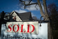 Greater Toronto home sales soared 37 per cent last month compared with the same month a year ago as lower borrowing costs associated with fixed-rate mortgages lured some buyers back to the market. A real estate sold sign is shown in a Toronto west end neighbourhood May 16, 2020. THE CANADIAN PRESS/Graeme Roy