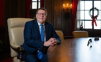 Saskatchewan Premier Scott Moe sits for a photograph in the cabinet room at the Saskatchewan Legislative Building in Regina, on Monday, Dec. 18, 2023. The Saskatchewan Party government is set to release its 2024 budget on a day that could be overshadowed by teacher protests. THE CANADIAN PRESS/Heywood Yu