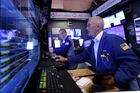 Traders work on the trading floor at the New York Stock Exchange (NYSE) in New York City, U.S., April 4.
