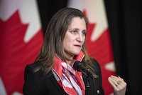 Minister of Finance and Deputy Prime Minister Chrystia Freeland speaks to the media at the Hamilton Convention Centre, in Hamilton, Ont., on Tuesday, January 24, 2023. The federal government failed to spend tens of billions of dollars in the last fiscal year on promised programs and services, including new military equipment, affordable housing and support for veterans. THE CANADIAN PRESS/Nick Iwanyshyn